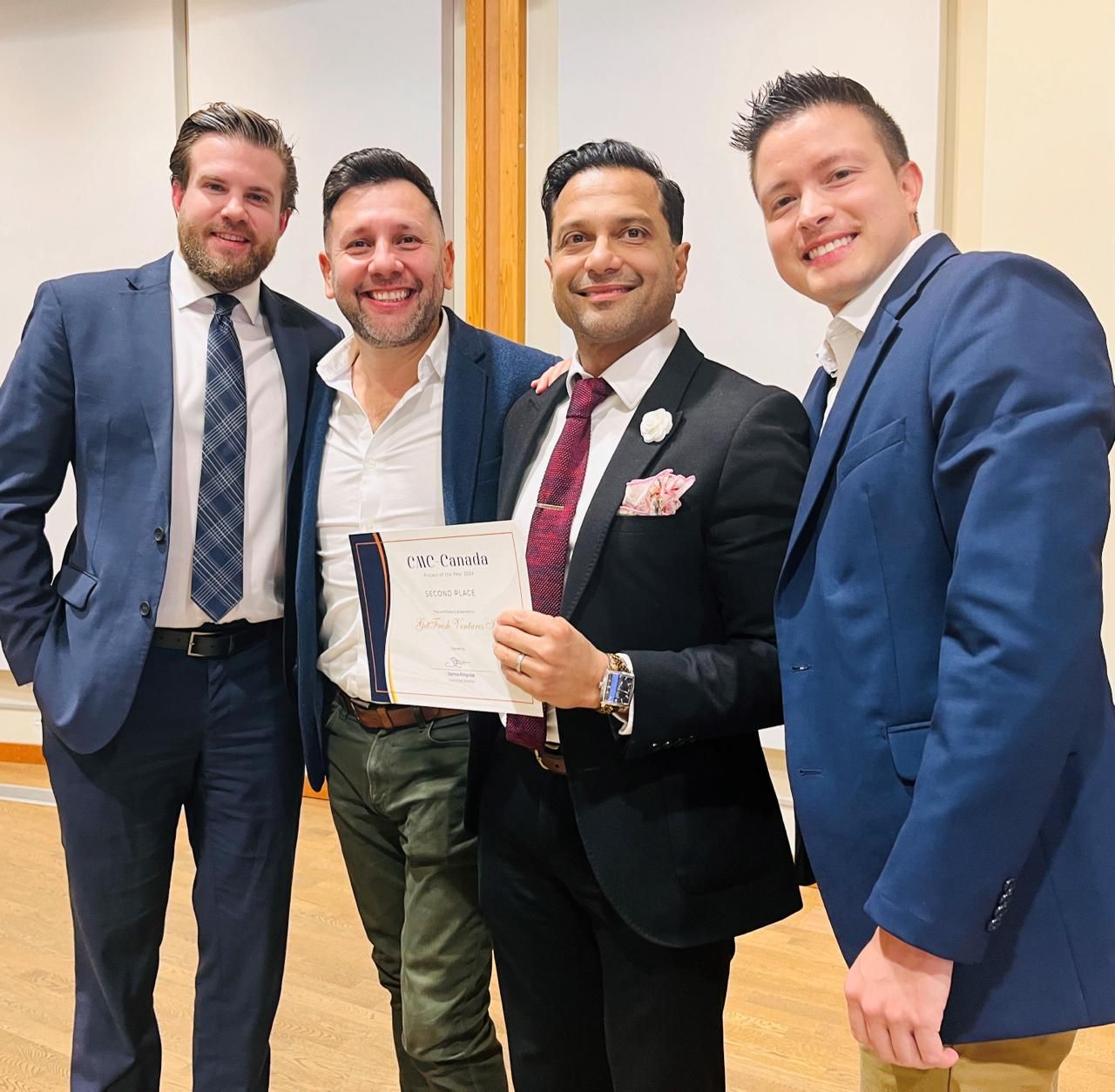 CMC Project of the Year Award ceremony - Brendan (GFV team), Alejandro Lopez, and Alejandro Otero (CompanyOn co-founder) receiving the award